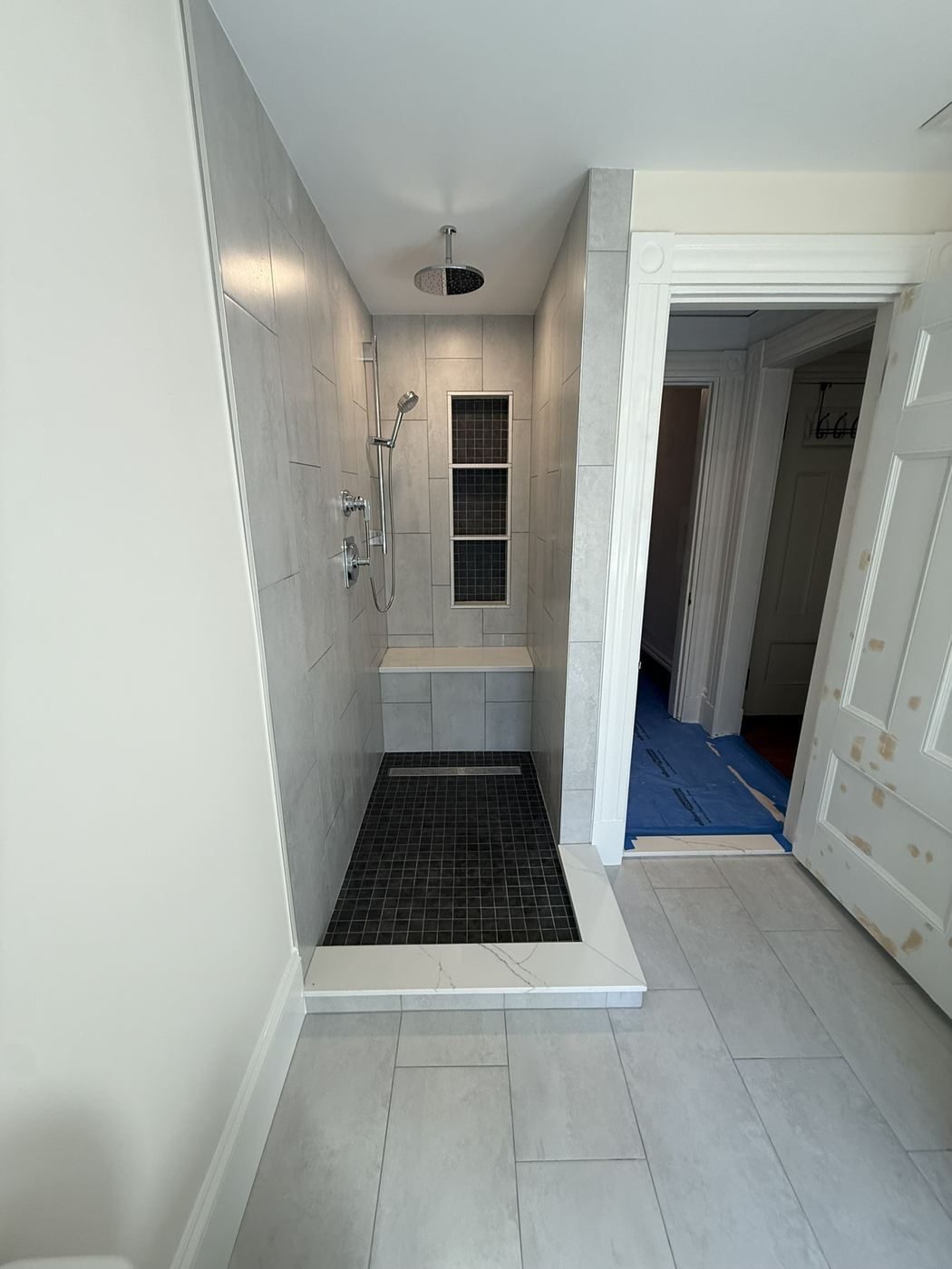 New walk-in tiled shower with bench and niche